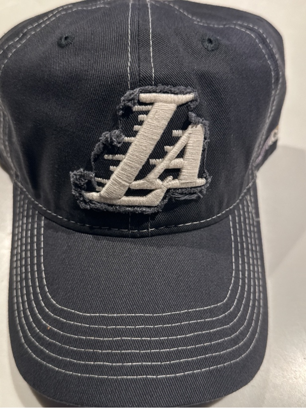 Distressed Navy Baseball Cap with White Embroidered Logo